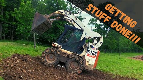 Skid Steer placing rubble, loading and spreading topsoil 